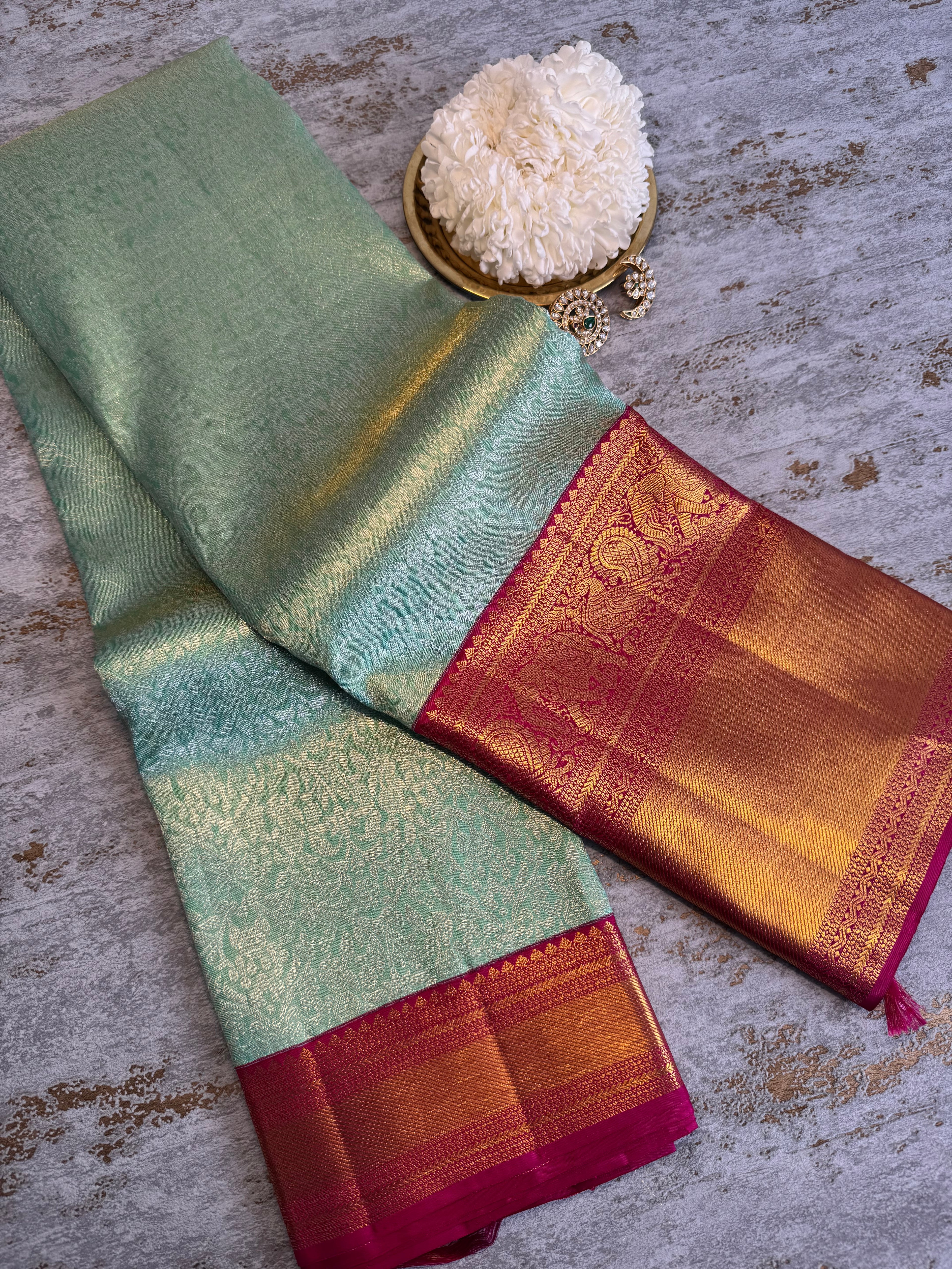 Pastel green  Kanchipuram silk saree with red zari border