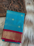 Teal blue semi silk saree with maroon border