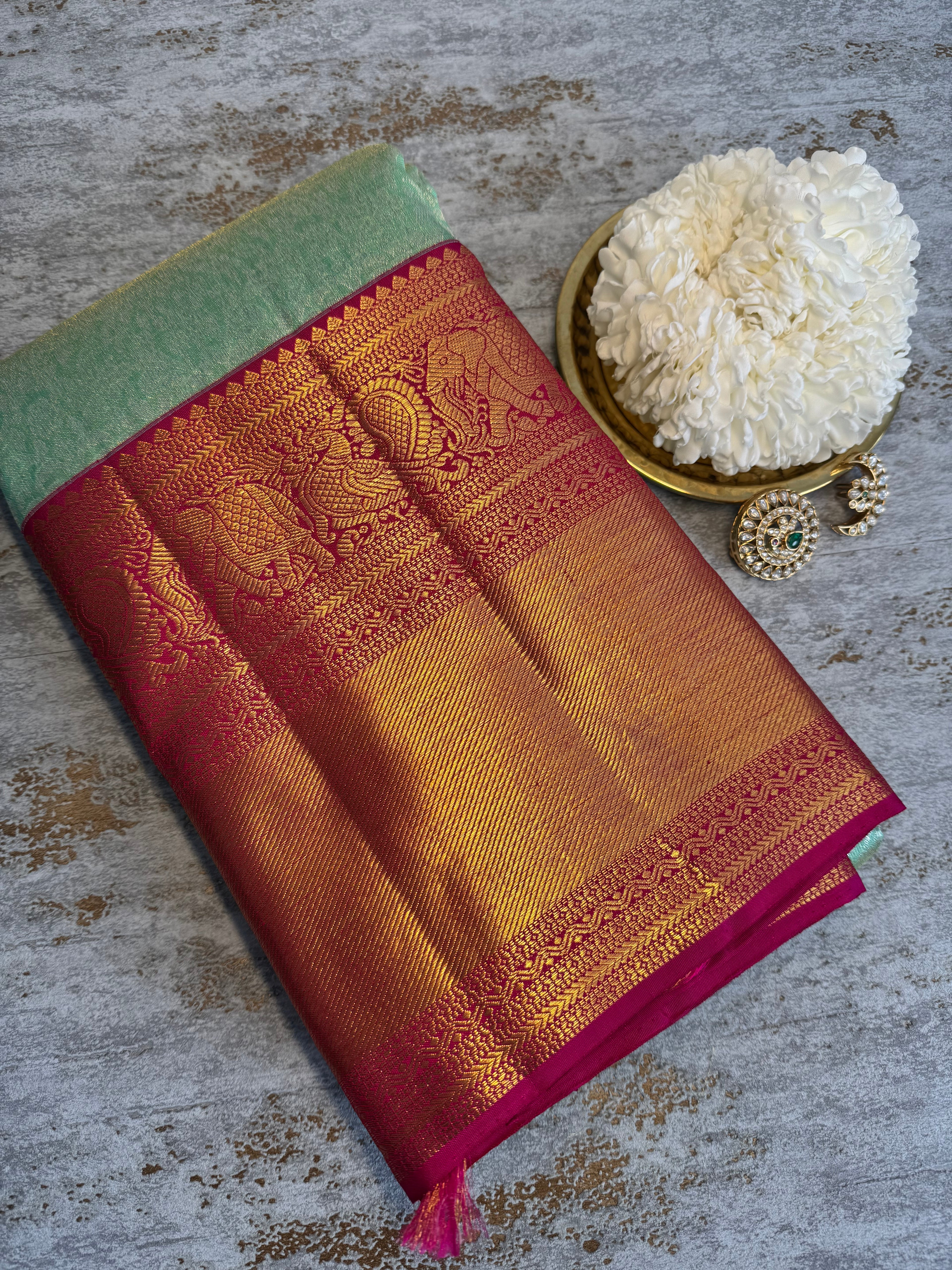 Pastel green  Kanchipuram silk saree with red zari border