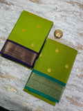Parrot green semi soft silk saree with dark blue borders